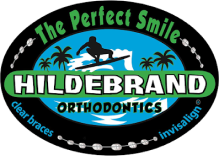 Hildebrand Orthodontics logo featuring tropical beach scene with palm trees and smile tagline.