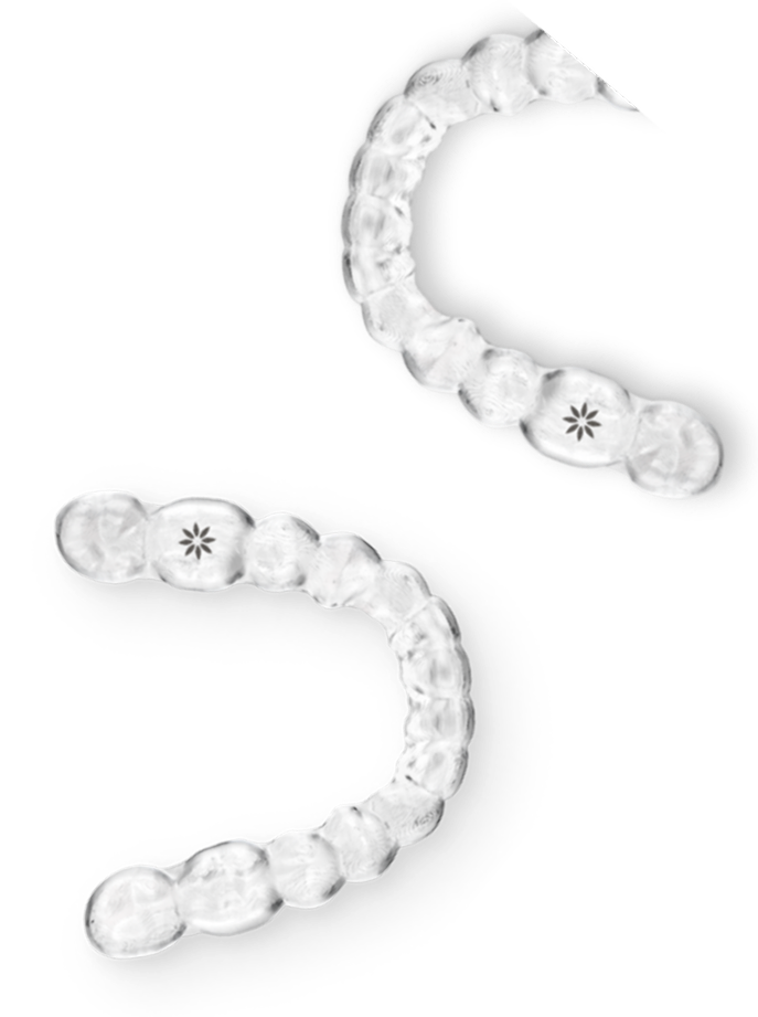 Clear orthodontic aligners displayed in curved S-shape formation against white background.